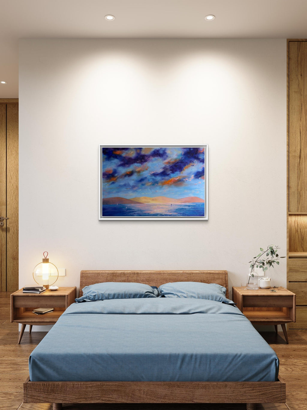 A framed abstract landscape painting with blue, purple, and orange tones hangs on a beige wall above a wooden bed with blue bedding in a modern bedroom setting.