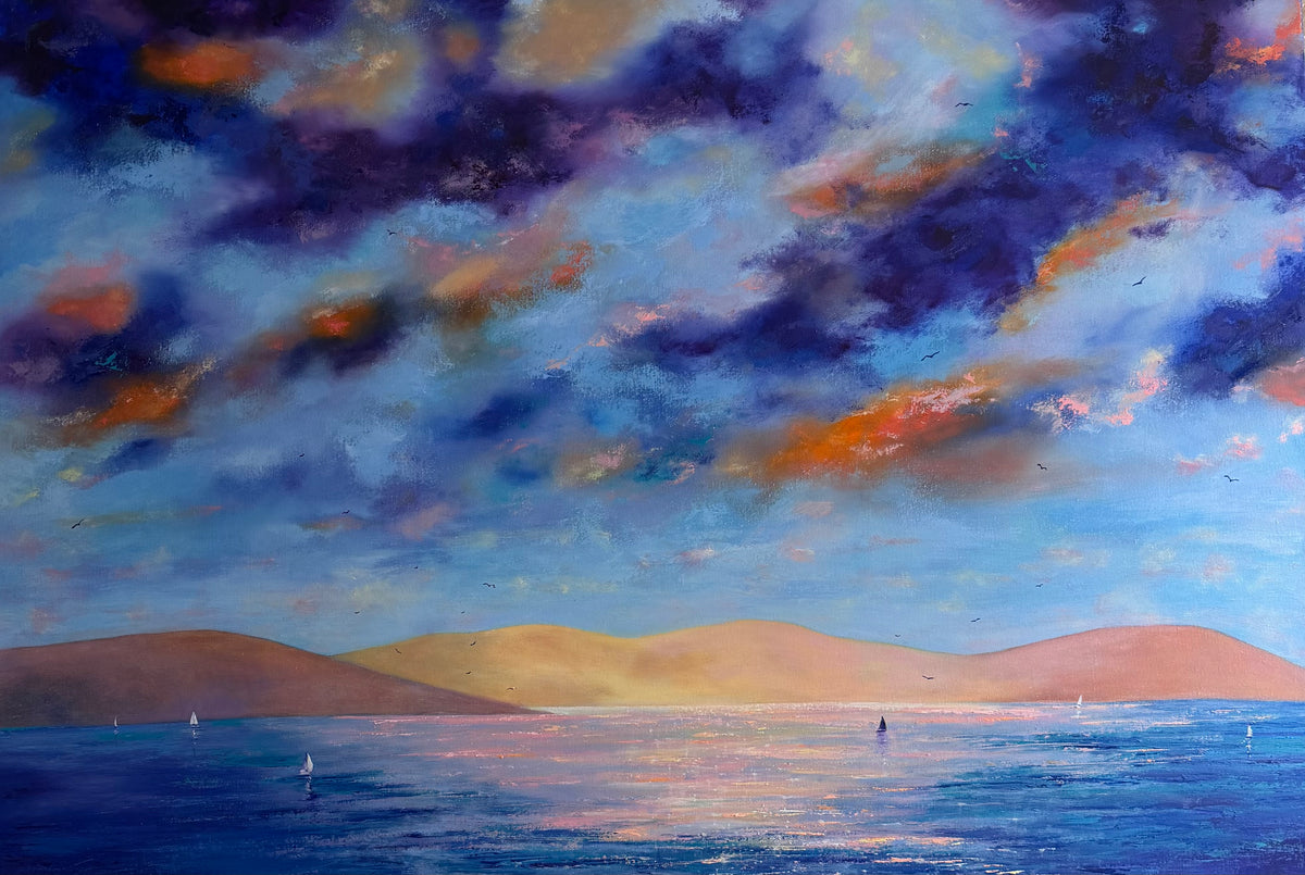 An impressionistic landscape painting of a seascape under a dramatic cloudy sky. The scene features deep blue and purple clouds with orange highlights, a calm blue sea with small sailboats, and soft golden hills in the background.