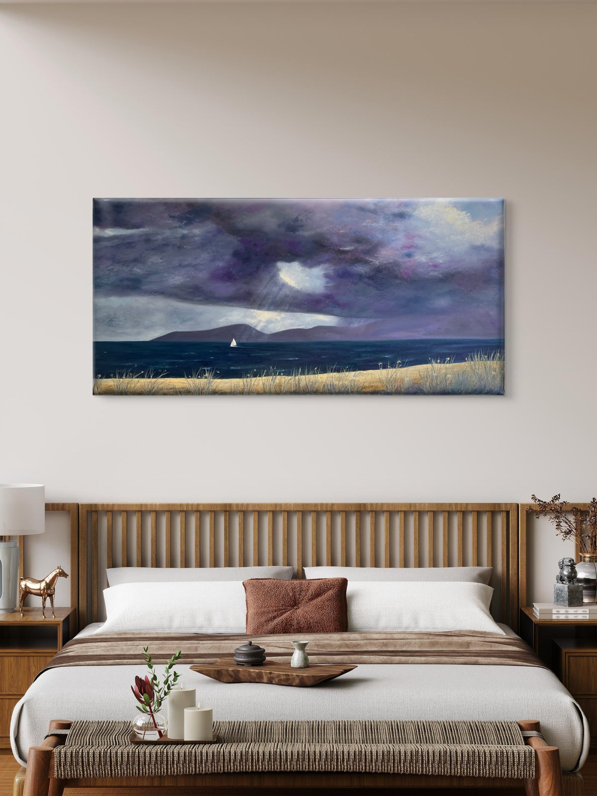 A panoramic canvas original oil painting depicting a dramatic stormy seascape with dark purple and gray clouds, a small sailboat on the horizon, and a golden grassy field, displayed in a modern bedroom setting above a wooden bed.